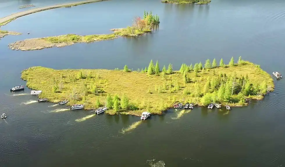 The Massive Floating Island of Lake Chippewa Requires Annual Coordination by Boats for Adjustment